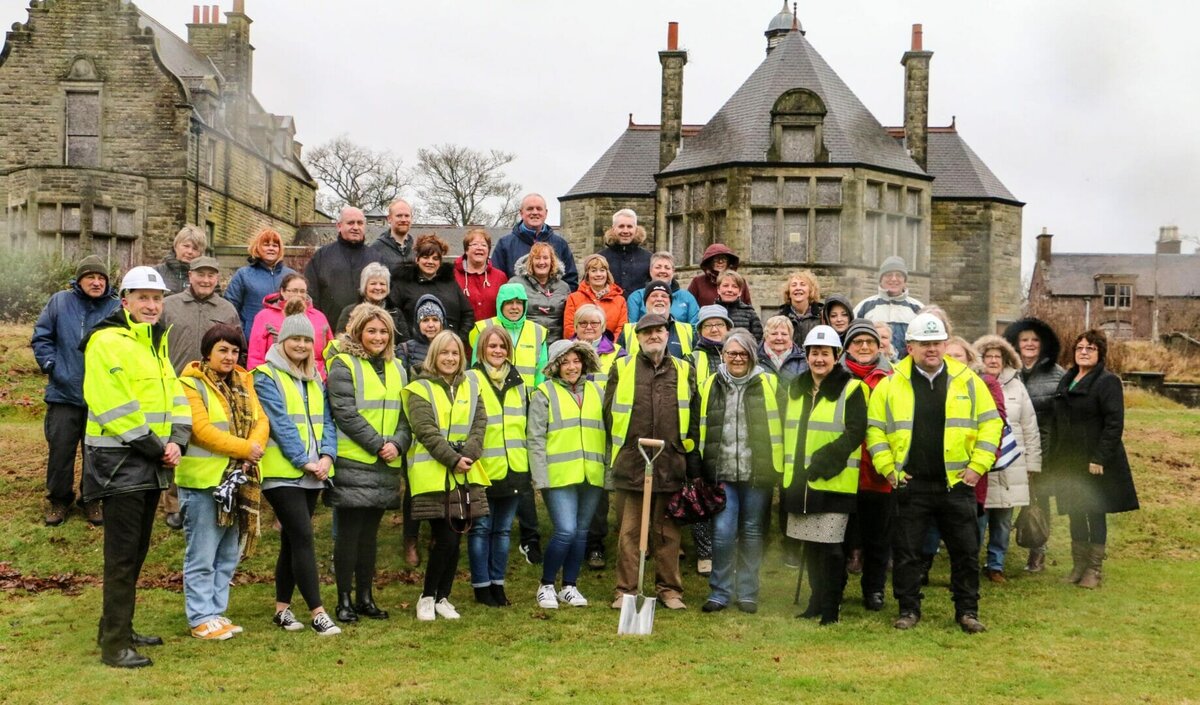 Ex-Sunnyside hospital staff cut turf marking the start of work on 35 new affordable homes on the historic site