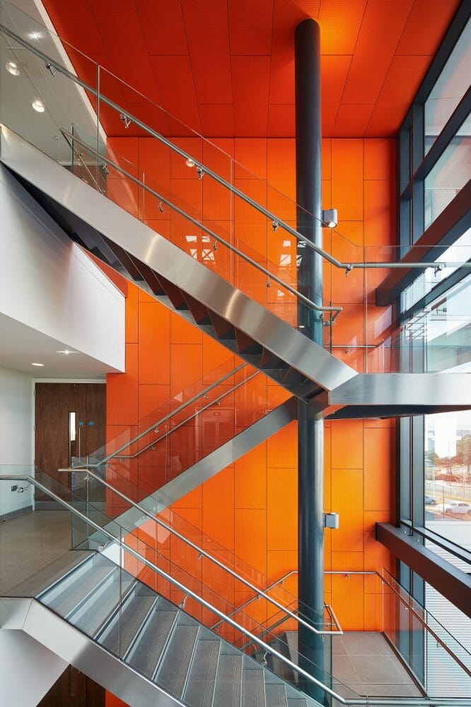Orange Armstrong Ceilings help the sun rise on a regeneration first