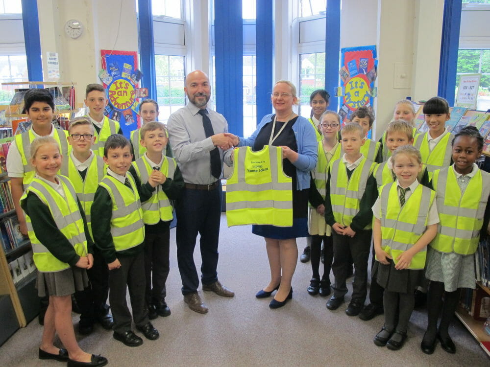 Covers donates high-vis vests to junior school @coverstimber
