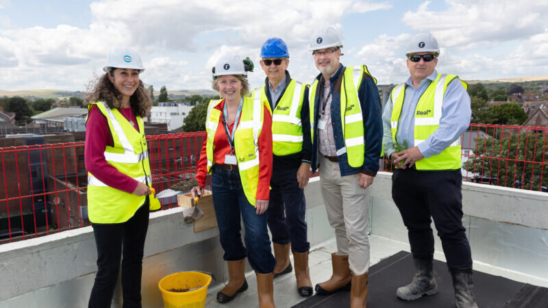 Real tops out The Mannings, a low carbon housing project in Shoreham-by-Sea.